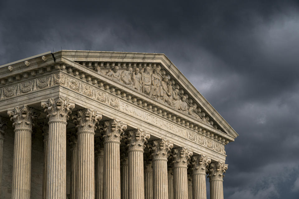 FILE - In this June 20, 2019, file photo, the Supreme Court in Washington. The Supreme Court is leaving in place the public nudity convictions of three women who removed their bathing suit tops on a New Hampshire beach as part of a campaign advocating for the rights of women to go topless. The justices declined Monday to review a state court decision that found no violation of the women's constitutional rights. (AP Photo/J. Scott Applewhite, File)