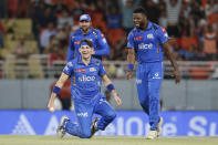 Mumbai Indians' Gerald Coetzee celebrates the dismissal of Punjab Kings' Liam Livingstone during the Indian Premier League cricket match between Punjab Kings' and Mumbai Indians' in Mullanpur ,India, Thursday, April 18, 2024.(AP Photo/ Surjeet Yadav))