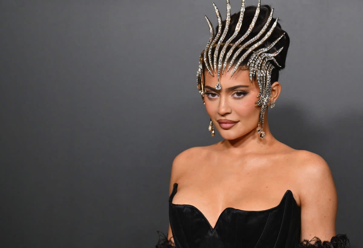 Kylie Jenner turns heads wearing statement diamond headpiece at the opening of the Thierry Mugler: Couturissime exhibition (AFP via Getty Images)