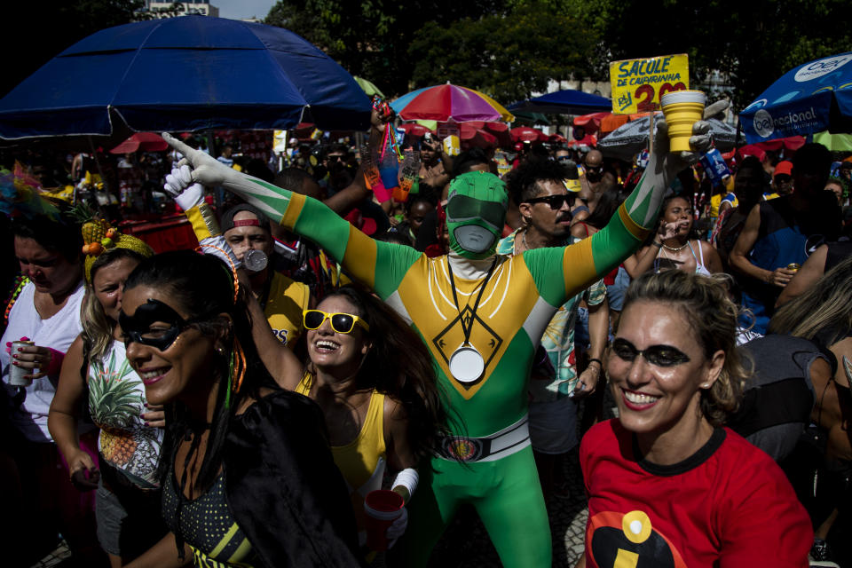 A reveler dance at the Desliga da Justica pre-Carnival block party, in Rio de Janeiro, Brazil, Saturday, Feb. 4, 2023. Desliga is a Portuguese language play on “Justice League”. (AP Photo/Bruna Prado)