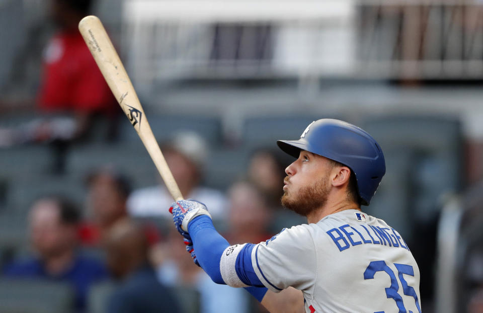 FILE - In this Aug. 16, 2019, file photo, Los Angeles Dodgers Cody Bellinger watches his home run during the third inning of the team's baseball game against the Atlanta Braves in Atlanta. Bellinger has beaten out Milwaukee Brewers’ Christian Yelich to win NL MVP. Bellinger got 19 of 30 first-place votes in balloting by the Baseball Writers’ Association of America revealed Thursday night, Nov. 14. (AP Photo/John Bazemore, File)