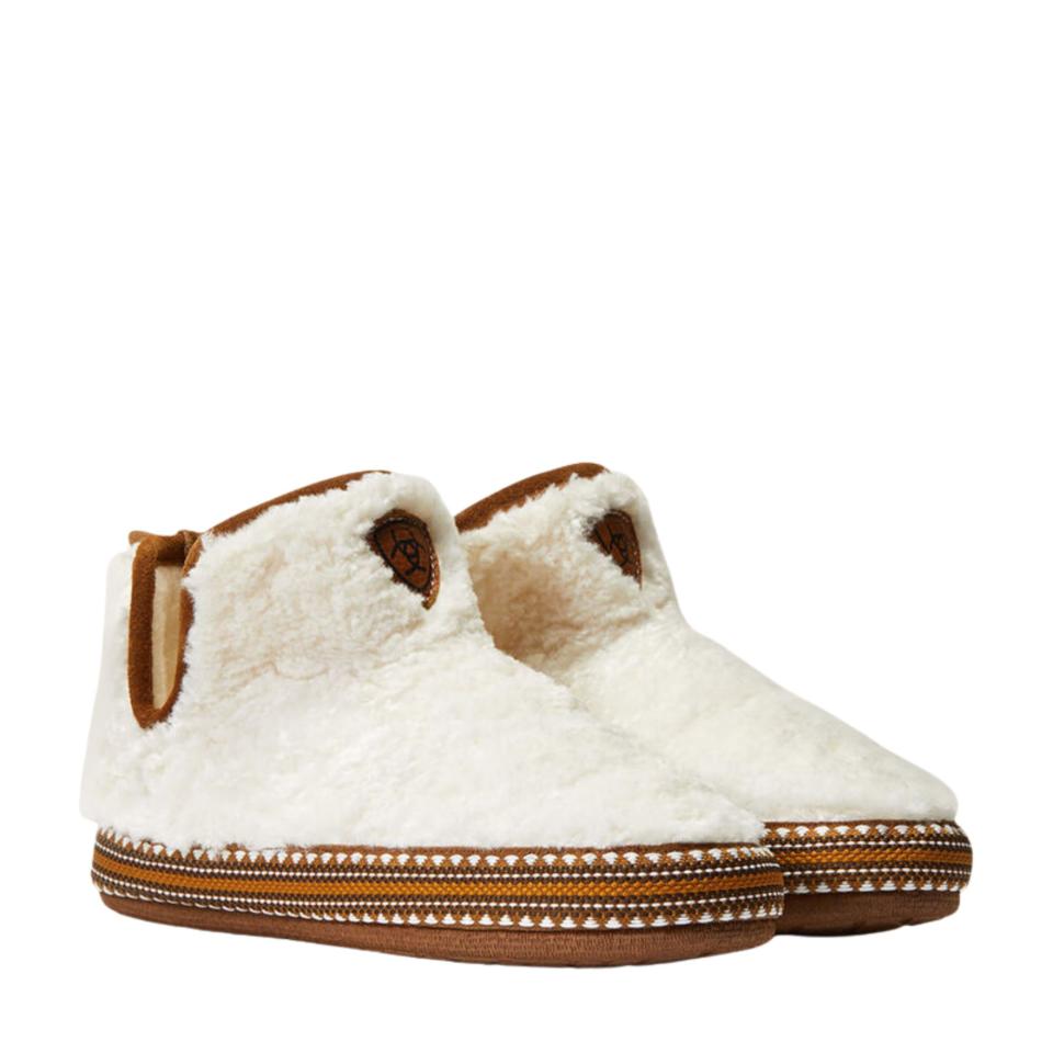 A pair of cream coloured sherpa-like slipper booties with brown suede soles.
