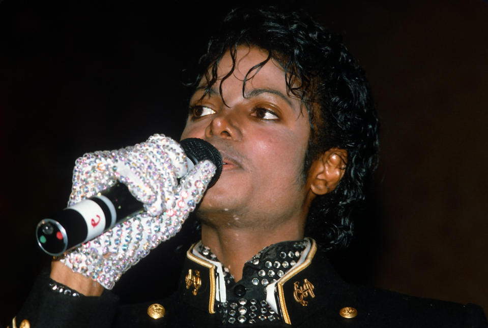 NEW YORK, NY - FEBRUARY 7:  Michael Jackson accepts an award from CBS and The Guinness Book Of World Records celebrating "Thriller" as the largest-selling album of all time (25 million) February 7, 1984 at the New York Metropolitan Museum of Natural History in New York City. This event is taking place 11 days after he suffered hair and scalp burns filming a Pepsi Cola commercial. (Photo by Yvonne Hemsey/Getty Images)