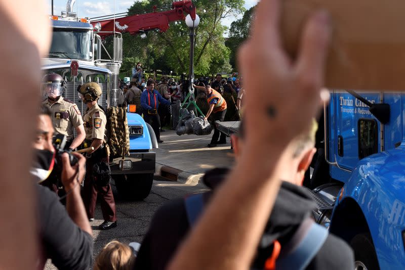 Demonstrators pulled down the statue of Christopher Columbus from the Minnesota State Capitol grounds