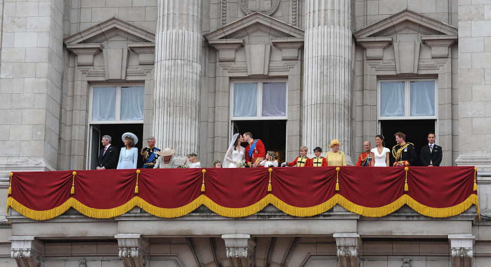 Kate Middleton's parents Michael and Carole Middleton (left) and members of the royal family join Prince William and his wife Kate Middleton, (centre) who has been given the title of The Duchess of Cambridge, as they kiss on the balcony of Buckingham Palace, London, following their wedding at Westminster Abbey.   (Photo by John Stillwell/PA Images via Getty Images)