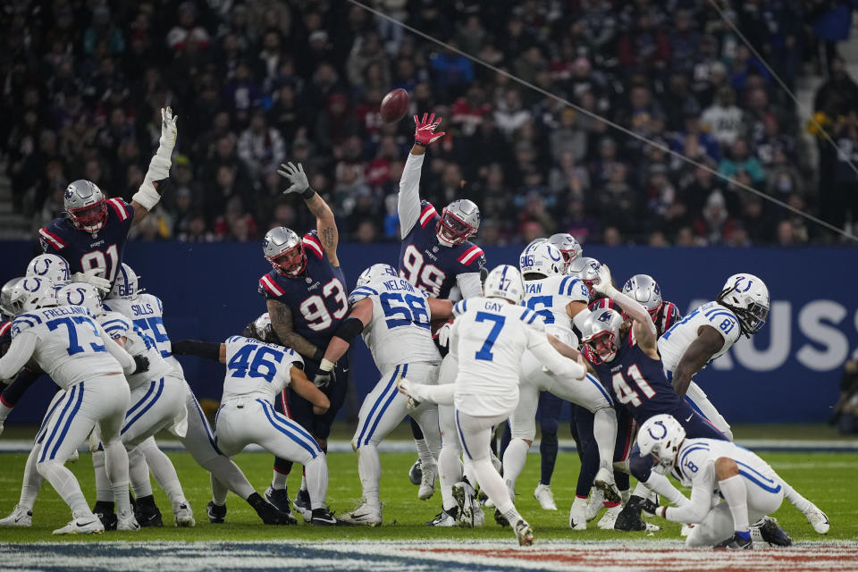 New England Patriots defensive ends Deatrich Wise Jr. (91), Lawrence Guy Sr. (93) and Keion White (99) try to block a missed field goal by Indianapolis Colts place-kicker Matt Gay (7) at the end of the first half of an NFL football game in Frankfurt, Germany Sunday, Nov. 12, 2023. (AP Photo/Martin Meissner)