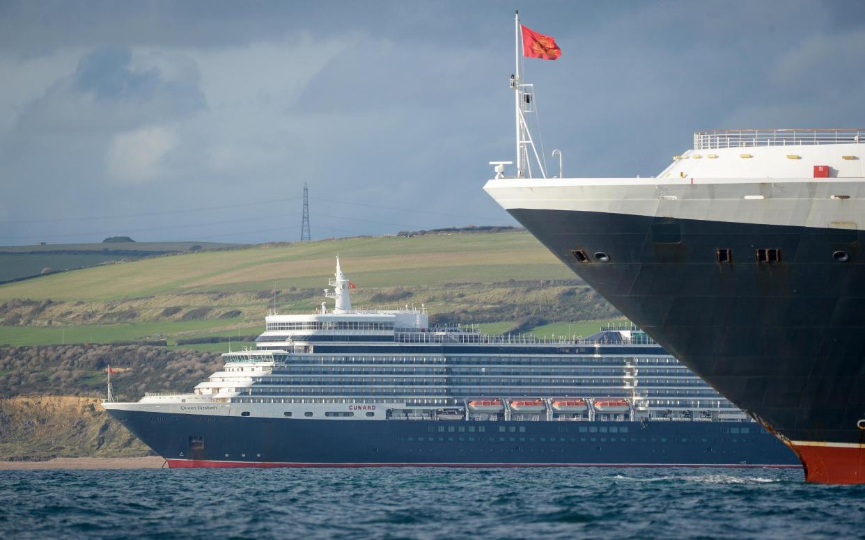 Cruise ships Queen Elizabeth and Queen Victoria are still anchored off the Dorset coast - Getty