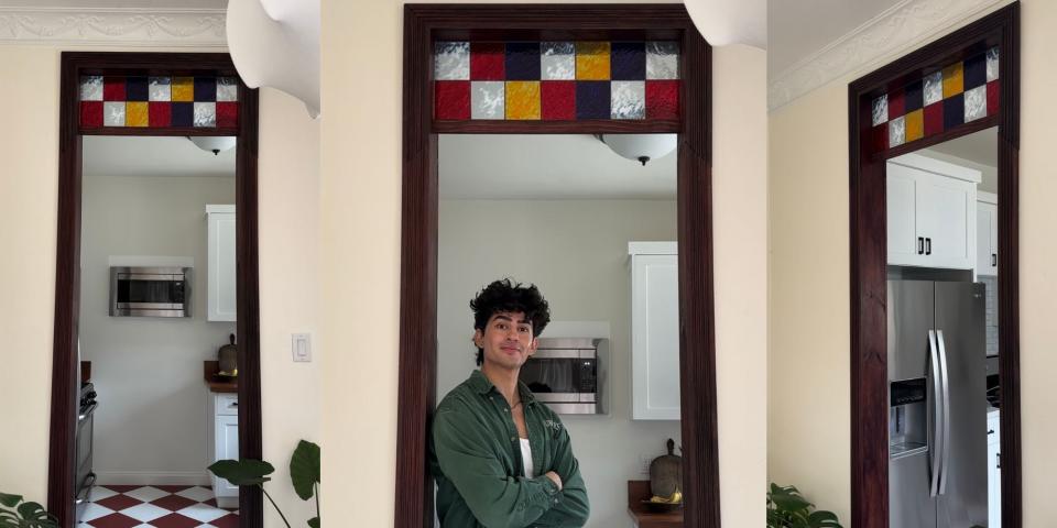 TikToker Marco Zamora standing beneath a faux stained glass window he'd created.