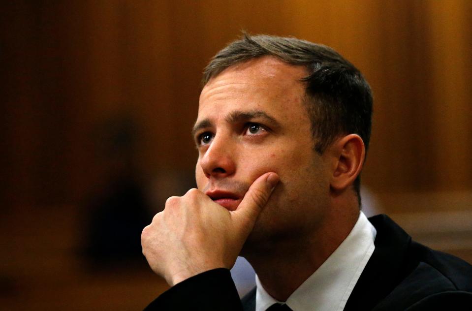 South African Paralympic and Olympic athlete Oscar Pistorius waits on October 16, 2014 before his sentencing hearing.