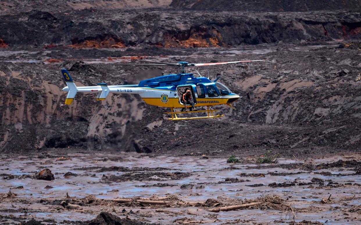 Rescuers search for victims of last week's dam collapse near the town of Brumadinho - AFP