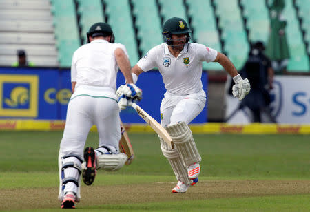 South Africa's Stephen Cook (L) and Dean Elgar run between wickets during the first cricket test match against New Zealand in Durban, South Africa, August 19, 2016. REUTERS/Rogan Ward