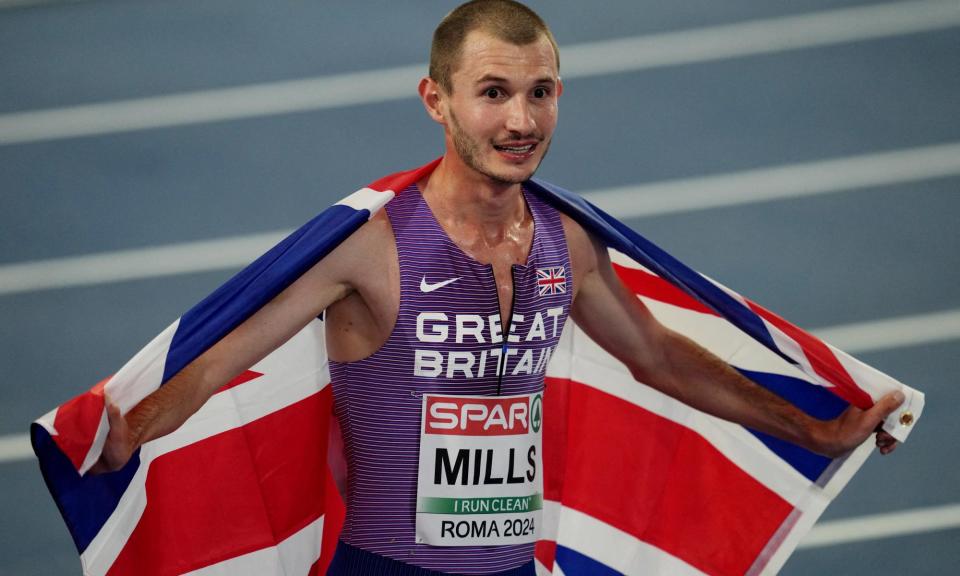 <span>A delighted George Mills on his lap of honour.</span><span>Photograph: Aleksandra Szmigiel/Reuters</span>