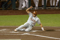 Texas Ivan Melendez (17) slides home in the second inning against Virginia during a baseball game in the College World Series Thursday, June 24, 2021, at TD Ameritrade Park in Omaha, Neb. (AP Photo/John Peterson)