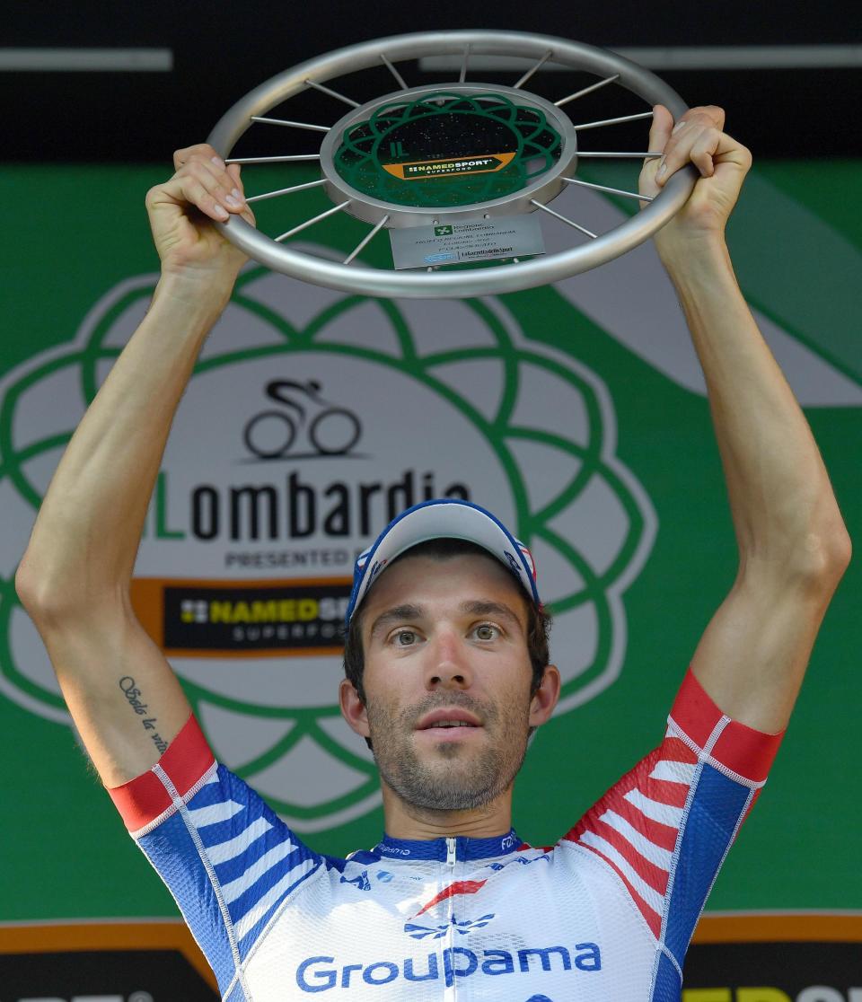 France's Thibaut Pinot celebrates on the podium after winning the Giro di Lombardia cycling race in Como, Italy, Saturday, Oct. 13, 2018. (Daniel dal Zennaro/ANSA via AP)