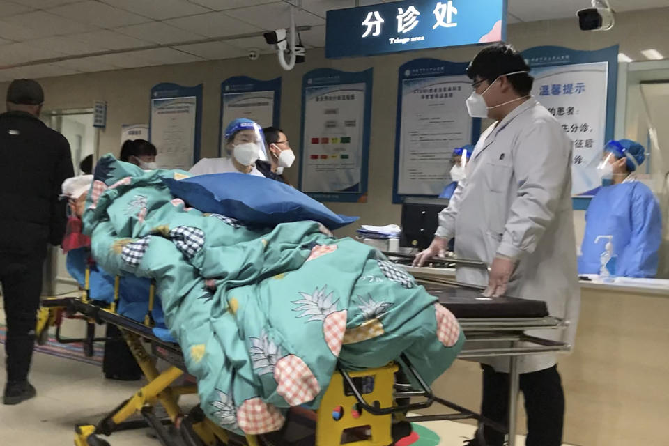 A patient is turned away from the emergency room due to full capacity at the Baoding No. 2 Central Hospital in Zhuozhou city in northern China's Hebei province on Wednesday, Dec. 21, 2022. China only counts deaths from pneumonia or respiratory failure in its official COVID-19 death toll, a Chinese health official said, in a narrow definition that limits the number of deaths reported, as an outbreak of the virus surges following the easing of pandemic-related restrictions. (AP Photo/Dake Kang)