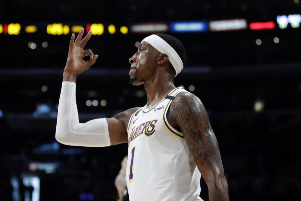 Los Angeles Lakers' Kentavious Caldwell-Pope (1) follows through on a 3-point basket during the second half of an NBA basketball game against the Boston Celtics Sunday, Feb. 23, 2020, in Los Angeles. (AP Photo/Marcio Jose Sanchez)