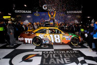 RICHMOND, VA - APRIL 28: Kyle Busch, driver of the #18 M&M's Ms. Brown Toyota, celebrates in Victory Lane after winning the NASCAR Sprint Cup Series Capital City 400 at Richmond International Raceway on April 28, 2012 in Richmond, Virginia. (Photo by Sean Gardner/Getty Images for NASCAR)