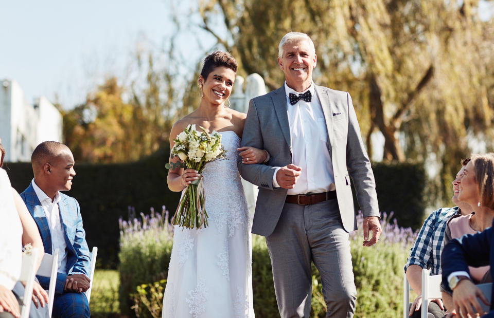 bride being walked down by her father