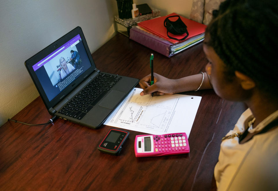 Abigail Previlon, 13, takes part in remote distance learning with her deaf education teacher Diane Gamse on October 28, 2020 in Stamford, Connecticut. (John Moore/Getty Images)