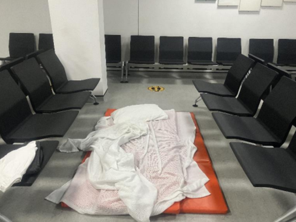 Mattress and bedding between chairs at Heathrow Terminal 3 (HM chief inspector)