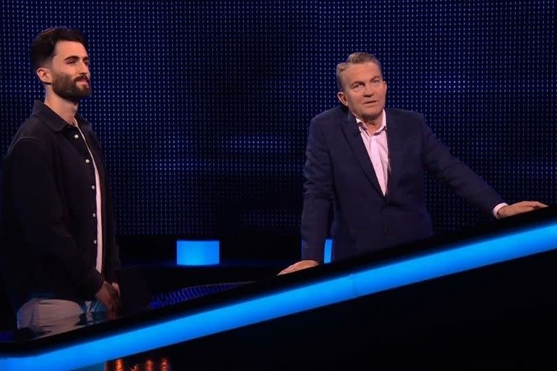 Theo with The Chase host Bradley Walsh -Credit:ITV