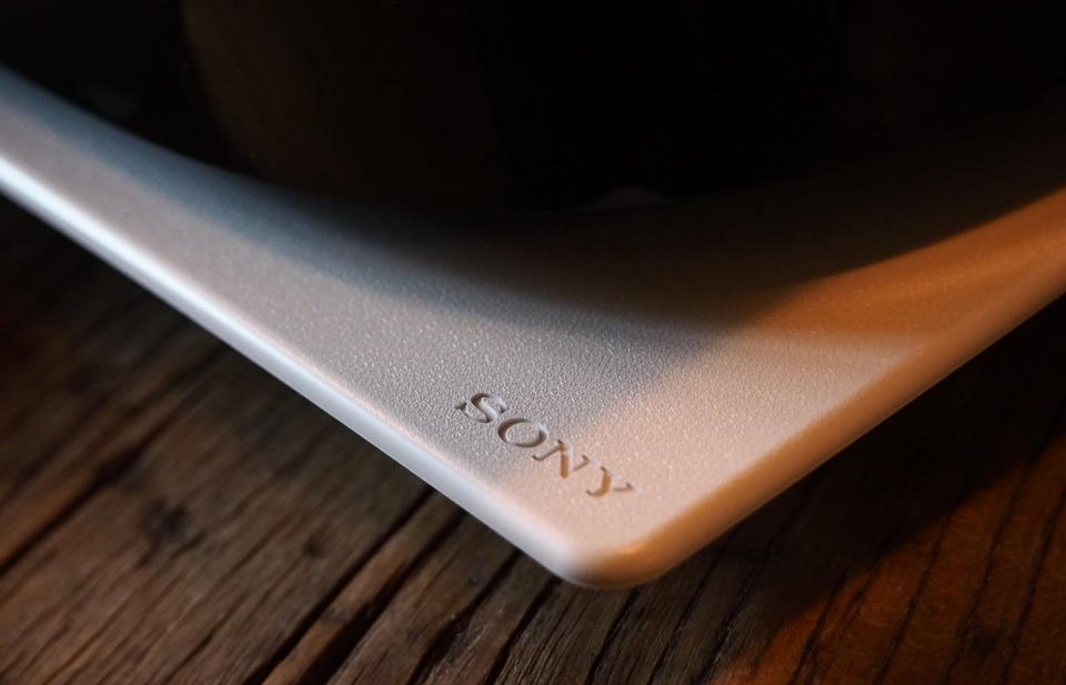 Close up of the Sony logo on the PS5 and tiny characters making a pattern.
