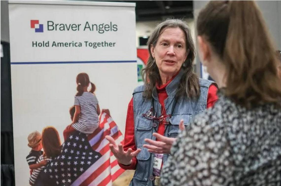 Sue Lani Madsen, left, Washington co-chair of the bridge-building group Braver Angels, talks to Elizabeth Doll, co-chair of the group’s Western Washington chapter. Braver Angels is a national, grassroots group that works to bridge partisan divides.