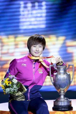 China's Ding Ning poses with her gold medal and trophy during the medal ceremony for the women's singles final table tennis match at the World Table Tennis Championships in Suzhou, Jiangsu province May 2, 2015. REUTERS/Aly Song