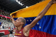 Yulimar Rojas, of Venezuela, celebrates after winning the final of the women's triple jump at the 2020 Summer Olympics, Sunday, Aug. 1, 2021, in Tokyo. (AP Photo/David J. Phillip)