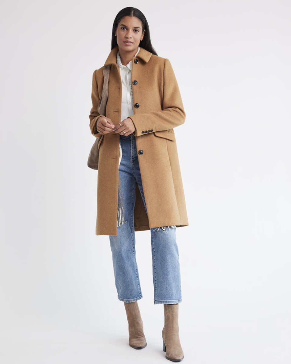 model wearing beige heeled boots, blue jeans and Classic Wool Coat in Camel (Photo via RW&CO)