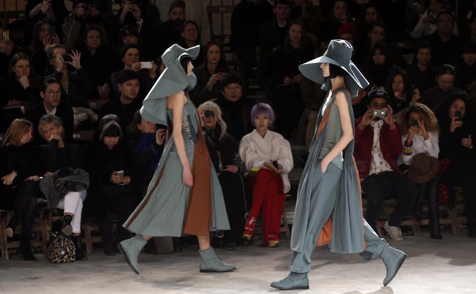 Models wear creations by Japanese fashion designer Yohji Yamamoto for his Fall/Winter 2013-2014 ready to wear collection, in Paris, Friday, March 1, 2013. (AP Photo/Christophe Ena)