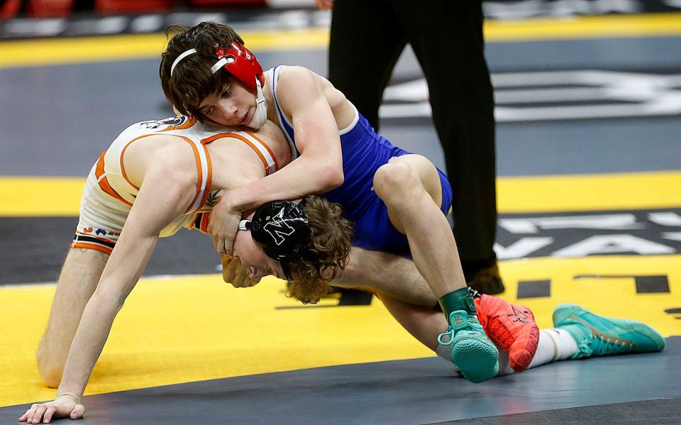 Tuslaw's Kaden Lawson wrestles Newcomerstown's Henry Booth in a 106-pound match at the OHSAA State Wrestling Championships, Friday, March 10, 2023, in Columbus.