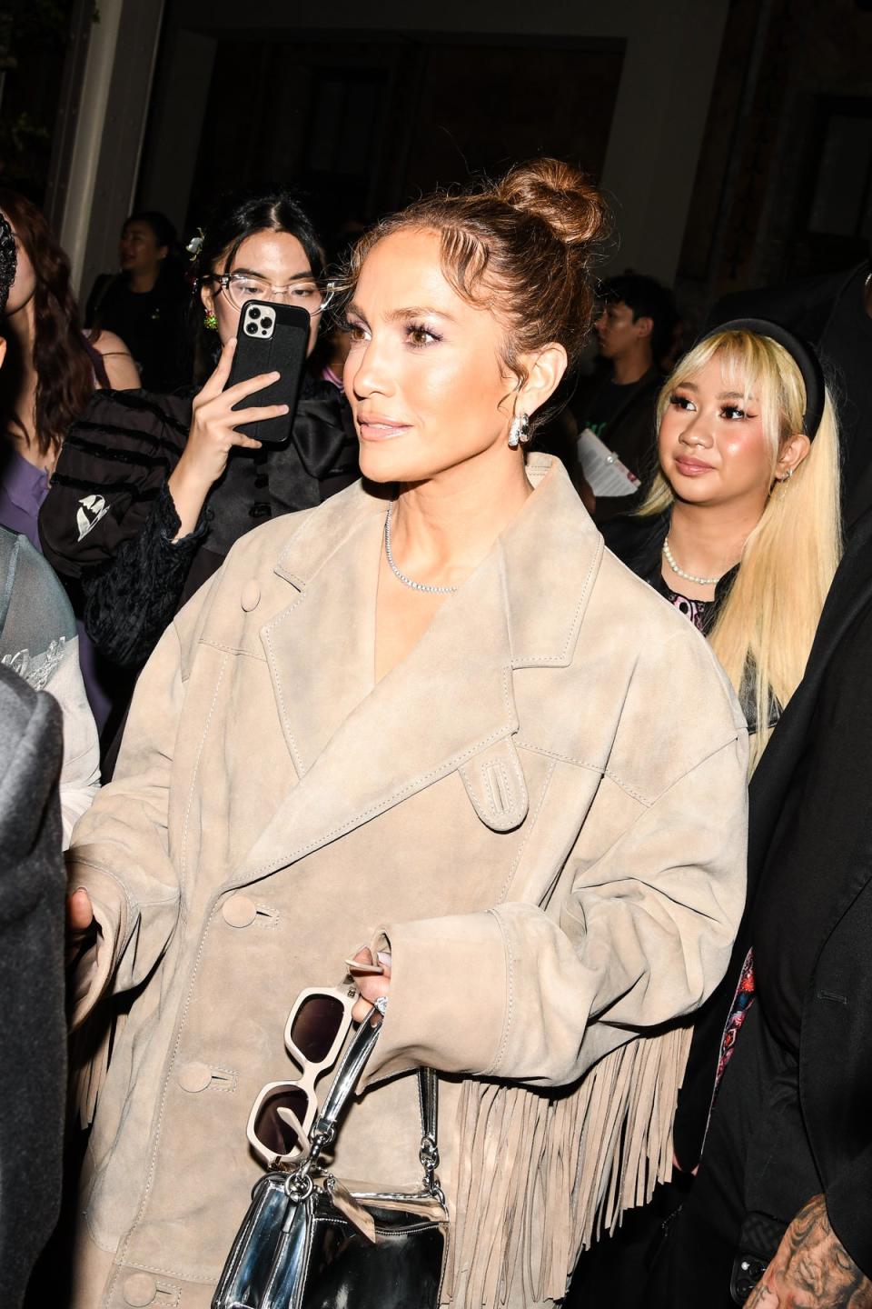 Jennifer Lopez attending Coach S/S24 show (WWD via Getty Images)