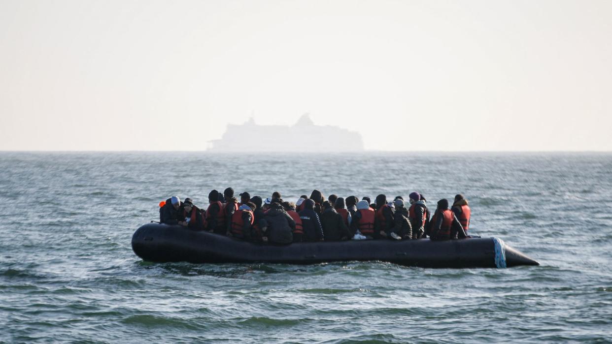  Migrants crossing the English channel in a small boat. 