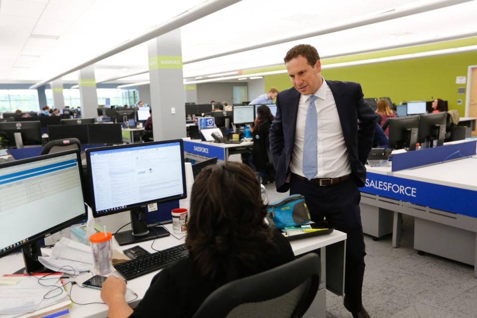 United Shore CEO Mat Ishbia speaks with Kathie Blazejewski of St. Clair Shores at United Shore's new headquarters in Pontiac, Mich. on Wednesday, June 20, 2018.