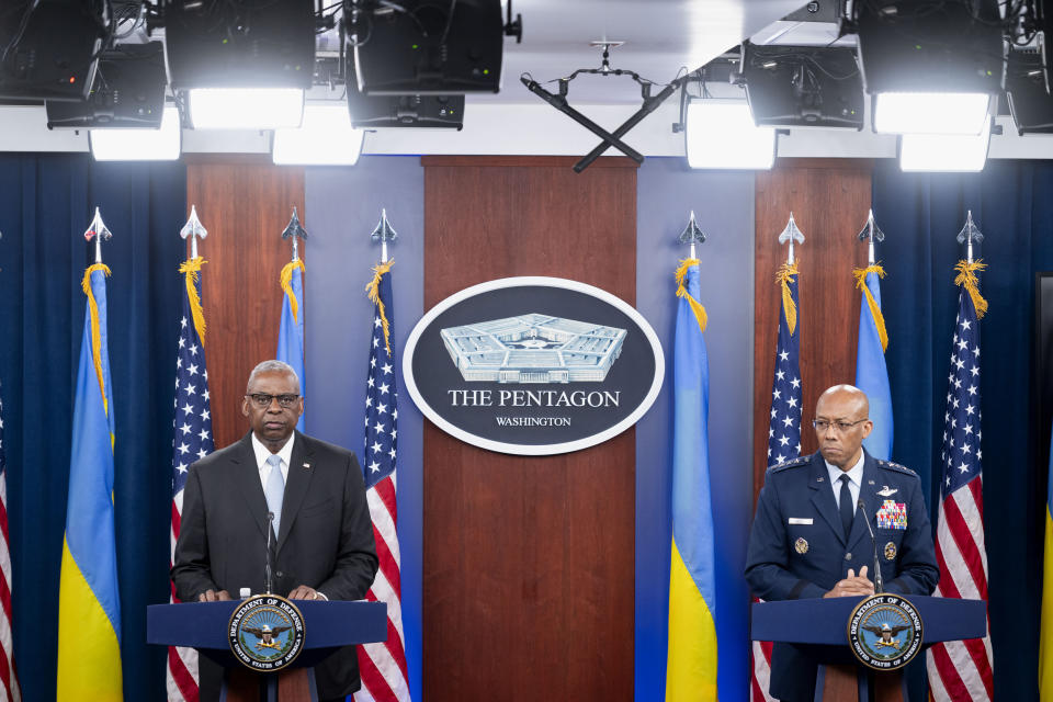 Defense Secretary Lloyd Austin, left, and Chairman of the Joint Chiefs Of Staff Gen. Charles Q. Brown, Jr. take part in a press briefing at the Pentagon on Monday, May 20, 2024, in Washington. (AP Photo/Kevin Wolf)