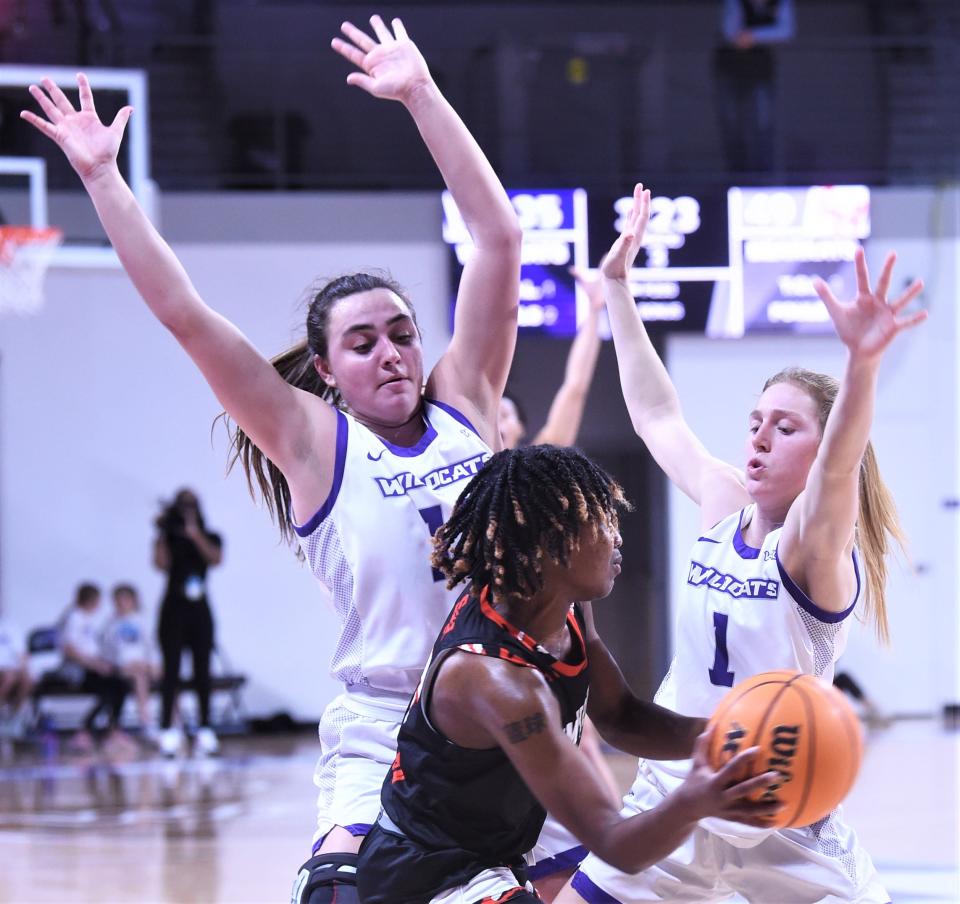 ACU's Addison Martin, left, and Aspen Martin defend against Sam Houston's Chyna Allen. The duo forced a turnover as the Bearkats couldn't get the ball past midcourt for a 10-second call with 3:21 left in the third quarter.