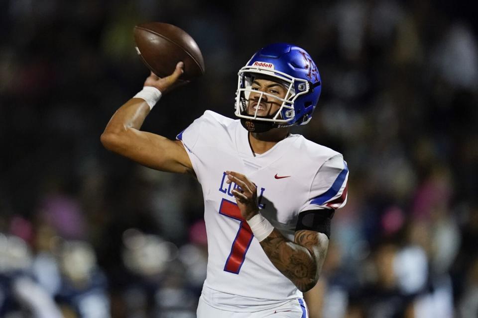 Los Alamitos High School quarterback Malachi Nelson throws during a high school football game