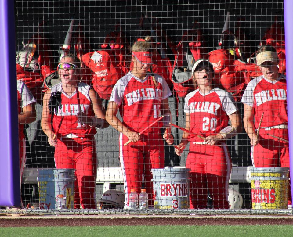 Holliday players, from left, Salem Henry (10), Hope Davis (15), Brynn Leach (20) and Evelyn Perkins (3) keep the beat for the Lady Eagles in the dugout against Coahoma.