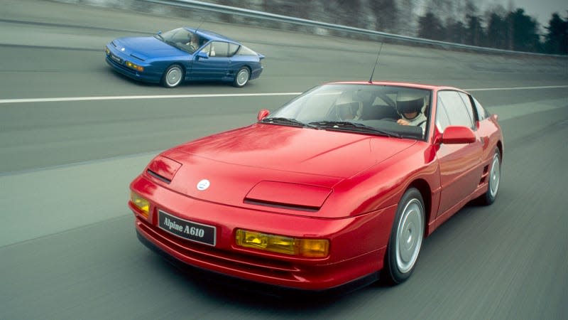 A photo of a red Alpine A610 on a race track. 