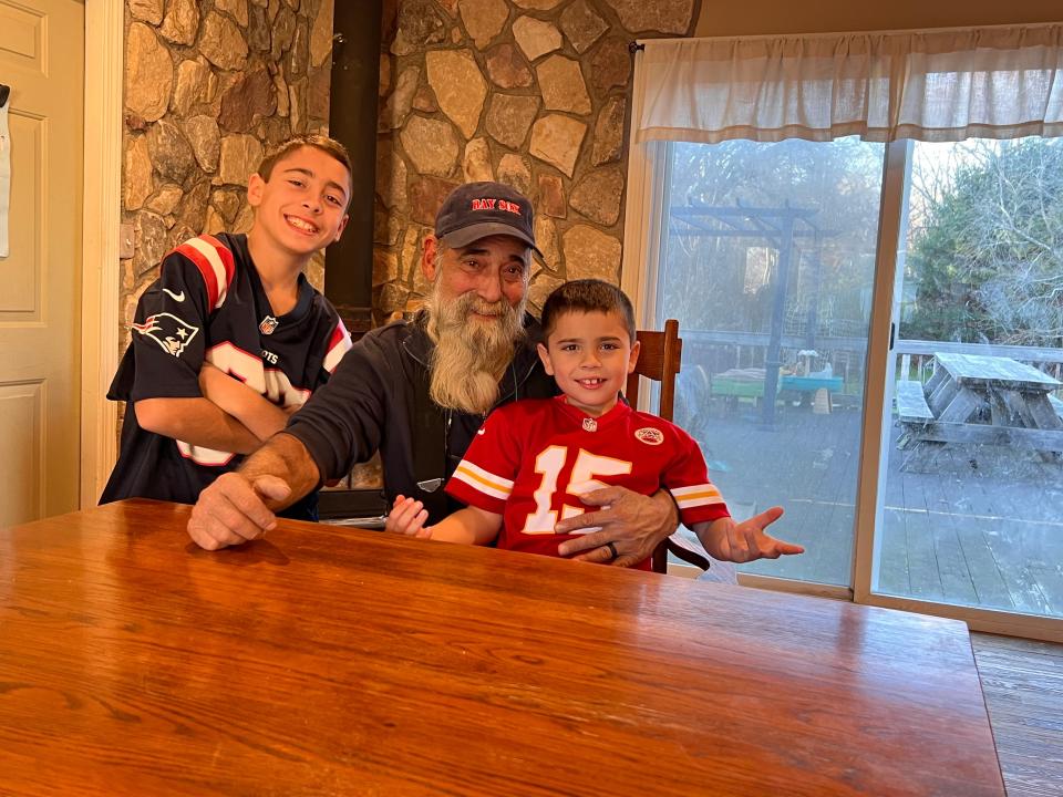 Brayden Cabral, left, with grandfather Nicholas DiGiammo and brother Chace.