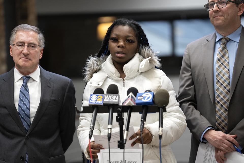 Janiah Caine, 18, who was previously in the care of Illinois Department of Children and Family Services as a minor, speaks about her experience during a press conference announcing a class action lawsuit alleging the DCFS has wrongfully incarcerated minors in its care. Thursday, Jan. 19, 2023, at the offices of Loevy & Loevy Attorneys at Law in Chicago. Caine spoke about the consequences of being locked up for so long, and about losing her grandmother while she was incarcerated. (AP Photo/Erin Hooley)