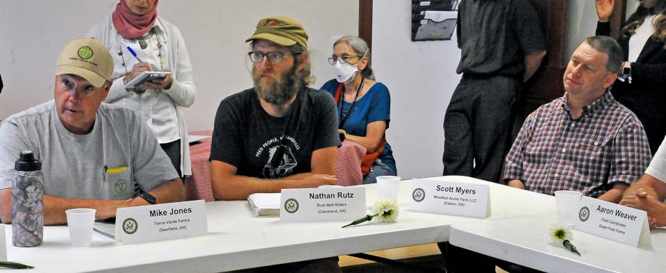 Mike Jones, Nathan Rutz and Scott Myers share their farming concerns with Sen. Sherrod Brown during a Tuesday roundtable discussion in Wayne County at Green Field Farms.