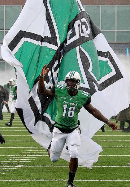 Marshall&#39;s Deon-Tay McManus runs onto the field just before the Conference USA championship NCAA college football game against Louisiana Teach in Huntington, W.Va., Saturday Dec. 6, 2014. (AP Photo/Chris Tilley)