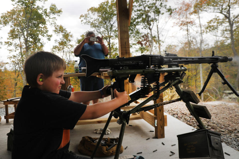 A young boy shoots an AR-15 and other weapons during the “Rod of Iron Freedom Festival” on October 12, 2019 in Greeley, Pennsylvania. The two-day event billed itself as a “Second Amendment rally and celebration of freedom, faith and family.”<span class="copyright">Spencer Platt—Getty Images</span>