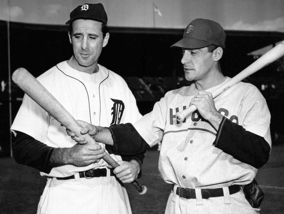 In this Oct. 4, 1945, file photo, Detroit Tigers leftfielder Hank Greenberg, left, and Chicago Cubs first baseman Phil Cavaretta talk before Game 2 of the World Series in Detroit.