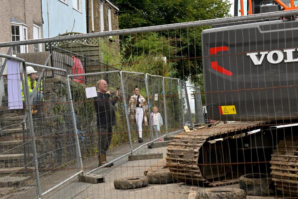 A defiant family has been left with no neighbours after refusing to move from a demolished street.

Mum-of-one Sophie Kendall, 28, grew up in the home that sits in the middle of a terraced row of houses. 

Work has begun to demolish the street after the houses were deemed at risk of a landslip in 2017.

Sophie and her family say they have had no offers from the council since their insurers have that their home is safe.

Pictured here is Sophie Kendall who lives in the house with daughter Jorgie-May, four, and stepdad Richard Morrison.

WALES NEWS SERVICE 


