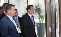 China's Prime Minister Li Keqiang, center, arrives at the Summit of Central and Eastern Europe and China in Dubrovnik, Croatia, Friday, April 12, 2019. EU member Croatia is hosting a two-day summit between China and 16 regional countries on expanding business between China and the region, which is dubbed 16+1. (AP Photo/Darko Bandic)