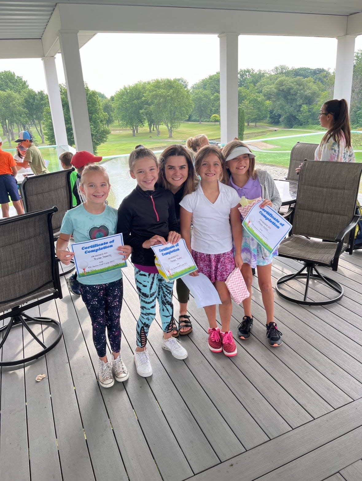Madeline Blum (center) is seen with participants of the junior golf program at Elks Golf Club in Port Huron in 2023.