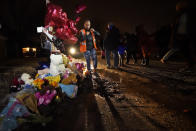 Sierra Rogers, who called Tyre Nichols her best friend, stands next to a memorial, after a prayer gathering at the site where he was beaten by Memphis police officers, and later died from his injuries, in Memphis, Tenn., Monday, Jan. 30, 2023. (AP Photo/Gerald Herbert)